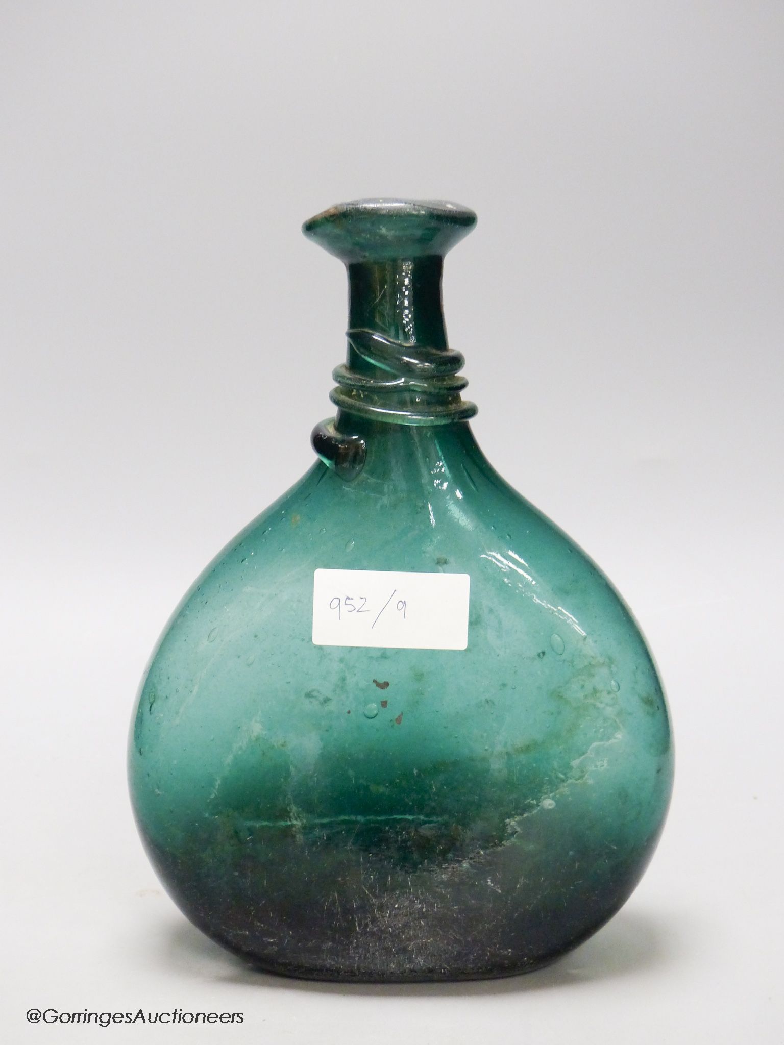 An 18th/19th century Persian green glass flask, Qajar dynasty, height 26cm